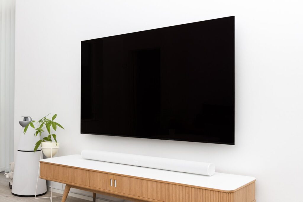 Large flat-screen television in a living room showing things that are 44 inches long