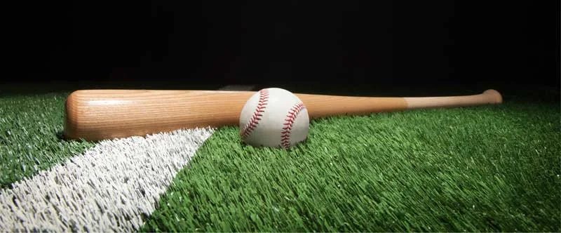 wooden baseball bat and ball on grass, a bat that is 29 inches long