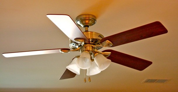 Ceiling fan in a room showing things that are 52 inches long