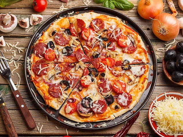 large pizza that is 14 inches wide, one of the common things that are 14 inches long