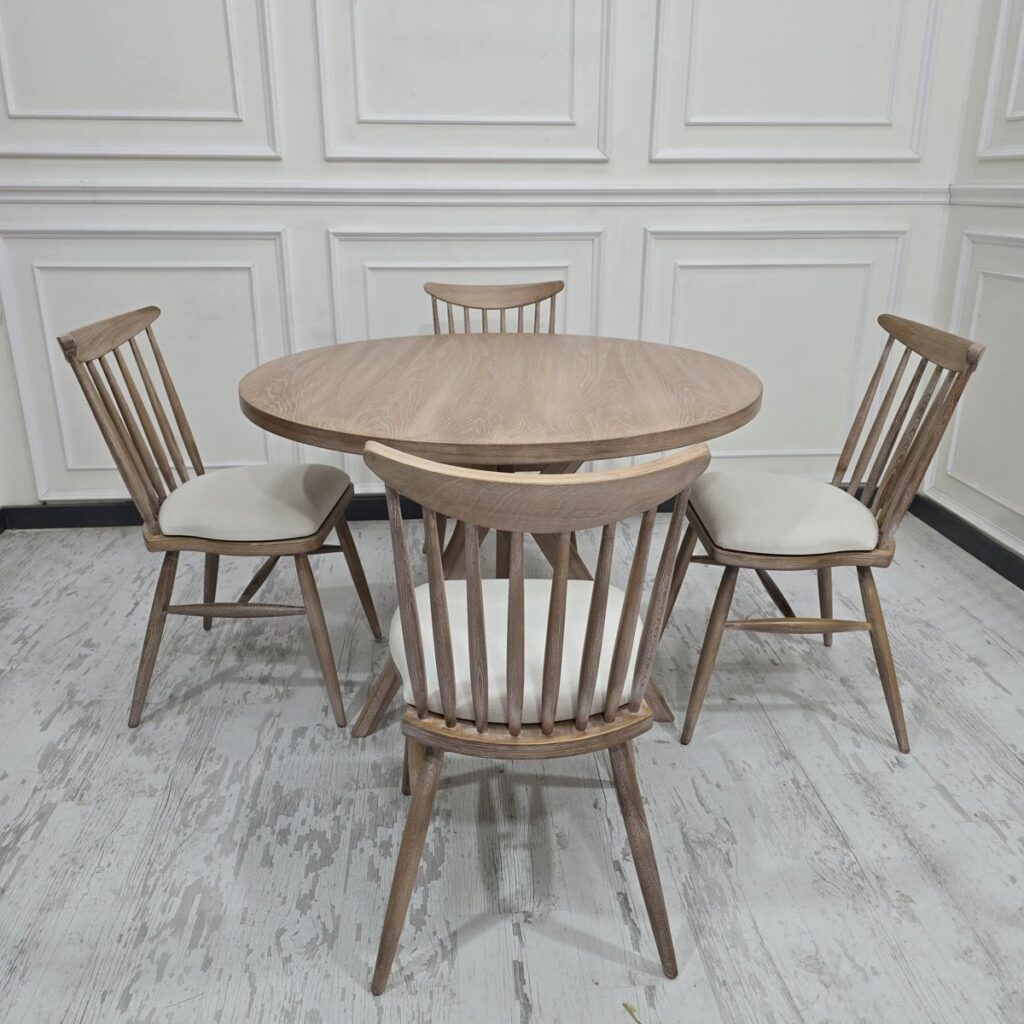 Round wooden dining table with chairs among things that are 48 inches long