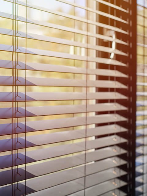 Window blinds on a window as an example of things that are 53 inches long