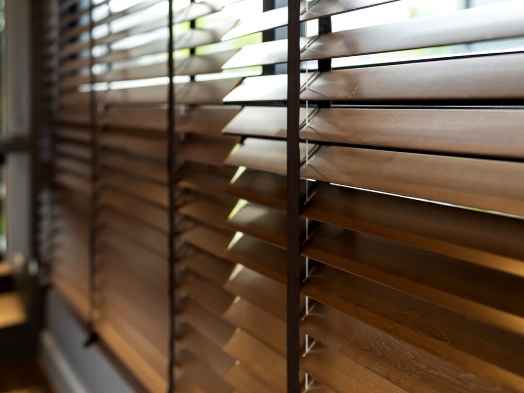 A wide window blind illustrating things that are 61 inches long